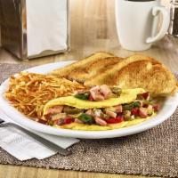 Wild West Omelette · Three-egg omelette with ham, fire-roasted bell peppers & onions, jalapeños and American chee...