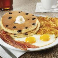 Blueberry Pancake Breakfast · Buttermilk pancakes cooked with blueberries. Served with two eggs, hash browns, plus two bac...