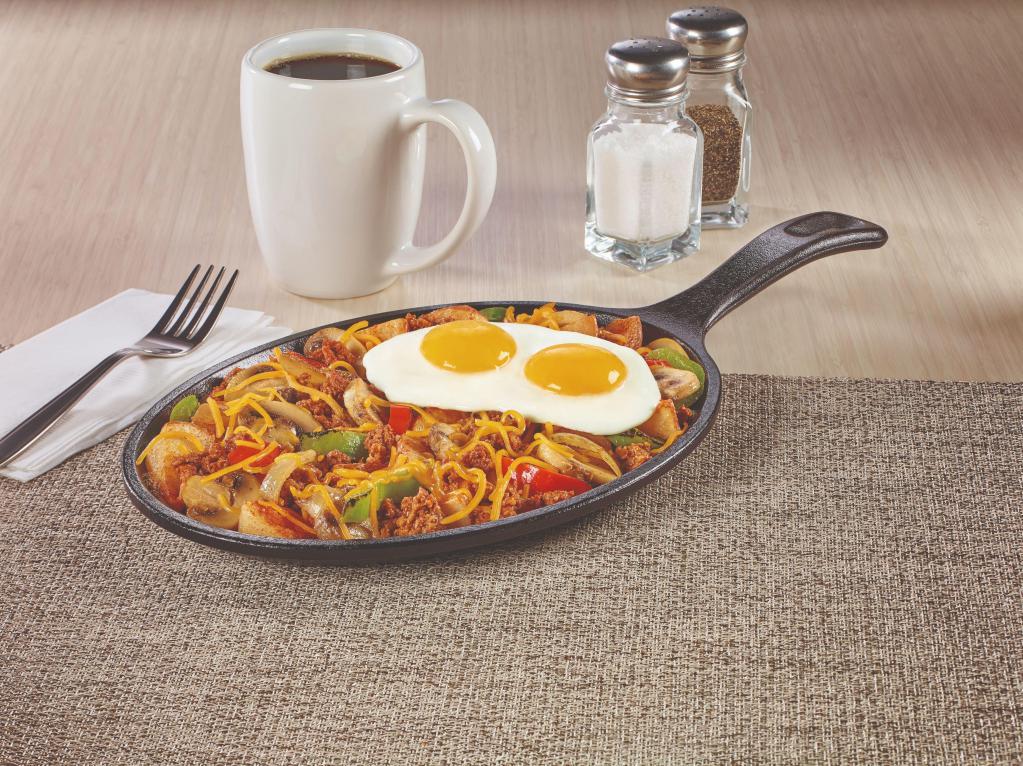 Santa Fe Skillet · Chorizo sausage, fire‑roasted bell peppers & onions, mushrooms and seasoned red‑skinned potatoes. Topped with Cheddar cheese and eggs. Gluten-Free.
