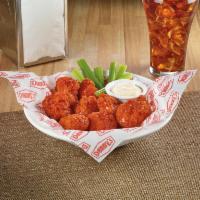 Boneless Chicken Wings · All-white-meat boneless wings, lightly breaded and tossed in BBQ or Buffalo sauce. Served wi...