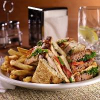 Club Sandwich · Turkey breast, bacon, lettuce, tomato and mayo on toasted 7-grain bread.