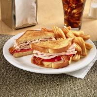 The Super Bird® · Turkey breast with Swiss cheese, bacon and tomato on grilled sourdough.