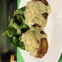 Cafe Egg Benedict Brunch · 2 poached eggs, callaloo hollandaise sauce, potato cake, Canadian bacon, and salad. Served w...