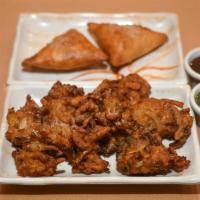 1. Vegetable Pakora · 7 pieces. Batter fried mixed vegetables, onion and potato. Served with tamarind and mint sau...