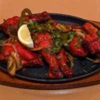 71. Tandoori Chicken · Whole chicken marinated in yogurt and spices and roasted in tandoor.