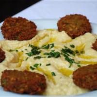 Falafel · 5 pieces of vegetarian patties made with chickpeas and spices. Crispy fried. Served with hum...