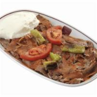 Iskender Kebab · Thin sliced marinated lamb and beef cooked on a vertical spit smothered in a fresh tomato sa...