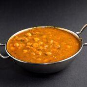 Channa Masala · Garbanzo beans, cooked with onion tomato and spices in a curry sauce.