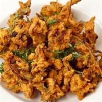 Onion Bhajee · 6 pieces, onion fritters deep fried with chickpeas flour and spices.