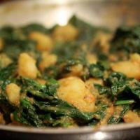 Chana Saag · Chicken peas cooked with spinach in herbs and spices.