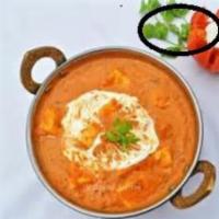 38. Paneer Makhini · Cubes of homemade cheese cooked with tomato sauce and spices. Vegetarian.