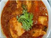 Fish Curry · Pieces of fish cooked in a curry sauce. Served with rice.