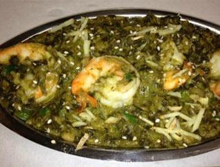 Shrimp Saag · Shrimp cooked with spinach, onions, garlic, ginger, cream and spices. Served with rice.