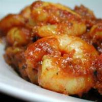 Shrimp Vindaloo · Shrimp and potatoes cooked in a flery hot curry sauce. Served with rice.