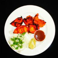 Chicken Boti · Boneless chunks of chicken breast pieces marinated in a spicy tikka sauce and grilled to per...