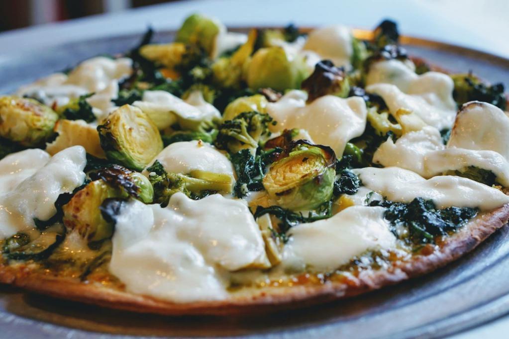 Brussels Sprouts Pizza · Brussels sprouts, bacon, mozzarella, provolone, and balsamic glaze.