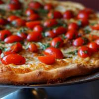 Bruschetta Pizza · Olive oil , garlic, mozzarella, cool cherry tomato salad, basil, balsamic, sea salt.