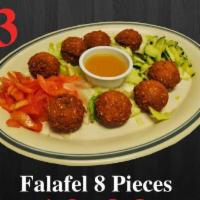 23. Falafel · Eight pieces. Served with bread, hummus, arabic salad, and speciel souce .