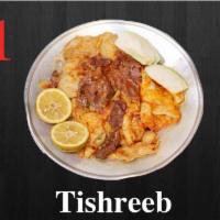 11. Tishreeb · Chopped tandoori bread in pieces with lamb shank served with meat stew.