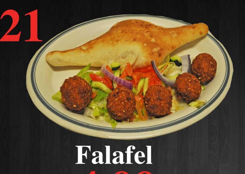 21. Falafel Sandwich · Ground chick peas mixed with peas mixed with parsley, deep fried wrapped in pita bread with hummus and salad.
