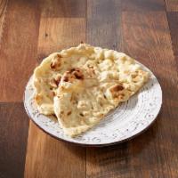 Naan · Unleavened handmade bread baked in a clay oven.