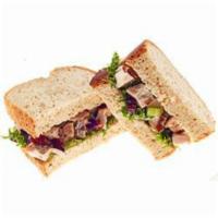 Loaded Chicken Salad Sandwich · Homemade chicken salad made with chopped chicken, glazed pecans, dried cranberries, celery, ...
