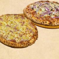 Double Deal · 2 pizzas with 2 free toppings each.