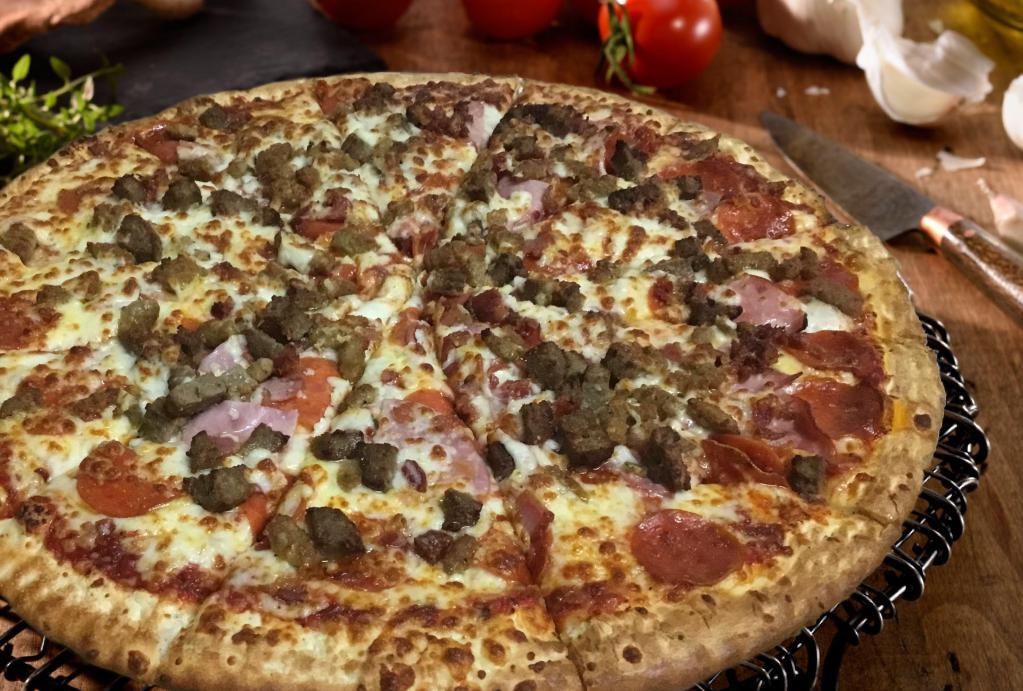 Meat Lovers Pizza · Tomato sauce, mozzarella, pepperoni, ham, Italian sausage, beef and bacon.