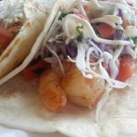 Baja Shrimp Tacos · 2 shrimp flour tortilla soft tacos garnished with chipotle cream sauce, cabbage, pico de gal...