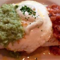 Cochon Burrito · Black beans, pulled pork, cheddar cheese wrapped in a flour tortilla, topped with fried egg,...