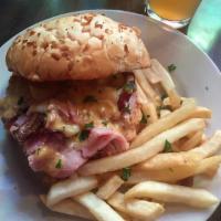 3 Little Pigs and The Big Bad Chicken Sandwich · Lightly battered chicken breast, Nueske's ham, Nueske's bacon and swiss cheese with a tasso ...