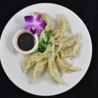Steam Dumpling · Steamed dumpling stuffed with vegetables, minced pork, served with bean sprout, chive and Th...