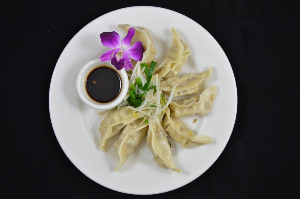 Steam Dumpling · Steamed dumpling stuffed with vegetables, minced pork, served with bean sprout, chive and Thai style soy ginger sauce.