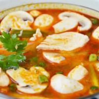 12. Tom Yum · Clear spicy soup with a touch of lemongrass, galanga root, kaffir leaves, tomatoes, onions, ...
