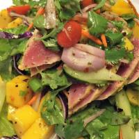 Ahi Mango Salad · Seared yellowfin tuna, black pepper, flavored with spicy lime sauce and tossed with lettuce,...