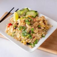 47. Hawaiian Fried Rice · Fried rice with chicken and shrimp egg, pineapples chunks, raisins, cashew nuts, tomatoes, c...