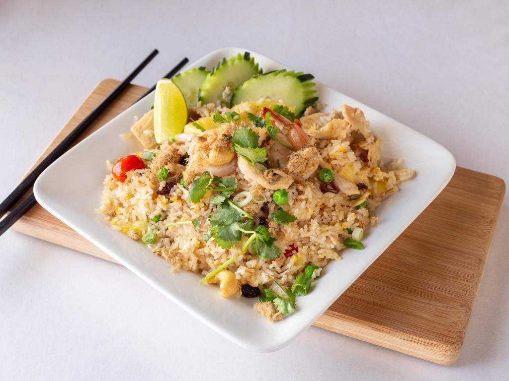 47. Hawaiian Fried Rice · Fried rice with chicken and shrimp egg, pineapples chunks, raisins, cashew nuts, tomatoes, carrots and green peas topped with cilantro and cucumber.