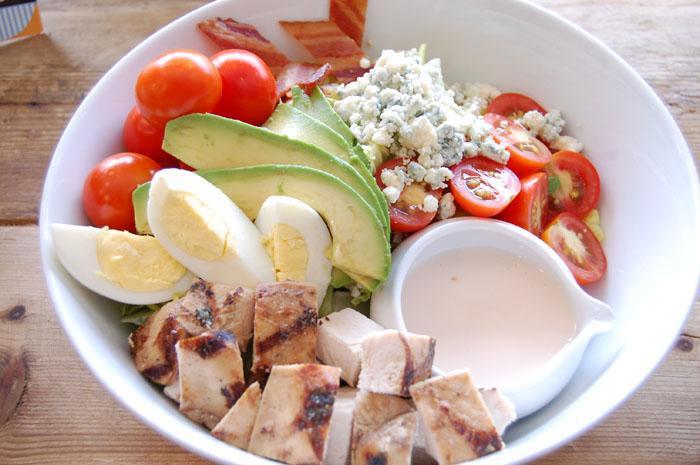 Cobb Salad · Romaine lettuce, grilled chicken, avocado, bacon, egg, tomatoes and Gorgonzola cheese.