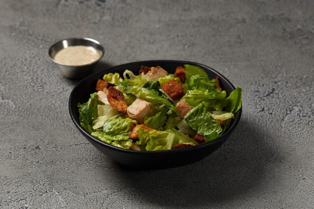 Chicken Caesar Salad · Grilled chicken, romaine lettuce, croutons, shaved Parmesan cheese and Caesar dressing.
