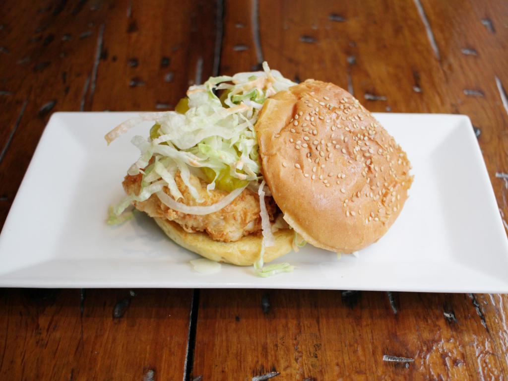 Buttermilk Fried Chicken Sandwich · Spicy mayo, shredded lettuce, pickle chips and white onions, served on sesame seed bun 