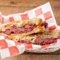 Chicago Reuben  · A Reuben deluxe made with pastrami, Swiss cheese, and sauerkraut served hot on rye bread wit...