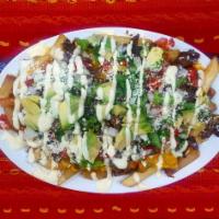 Steak Fries · With avocado and Central American cream. 
