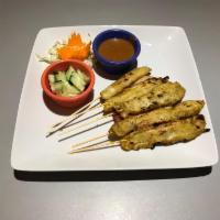 2. Chicken Sate (5) · Char broiled marinated chicken breast on bamboo skewer served with peanut sauce, toast and s...