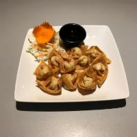 4. Crab Rangoon · Special mixed cream cheese and crab meat wrapped in wonton skin then golden deep fried, serv...
