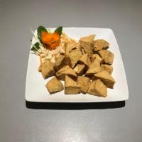 5/b. Golden Deep Fried Tofu · Crispy deep-fried chunks of tofu served with sweet lime sauce.