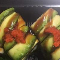 Dragon Roll · Eel and cucumber topped with avocado and eel sauce.