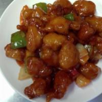 44. Sweet and Sour Chicken · Lightly battered chicken with pineapple, onions and bell peppers tossed in sweet and sour sa...