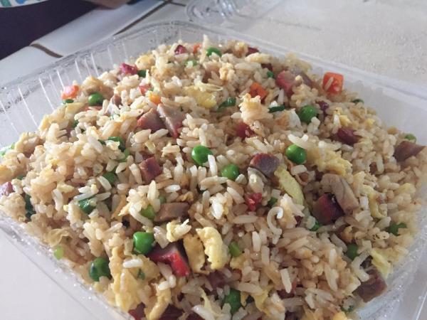 112. BBQ Pork Fried Rice · White rice wok fried with BBQ pork, eggs, peas, carrots and green onions.