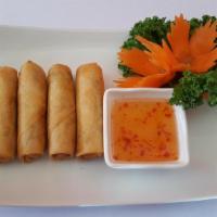 Crispy Egg Rolls Appetizer · Deep fried miniature egg rolls stuffed with chicken and veggies served with sweet and sour s...