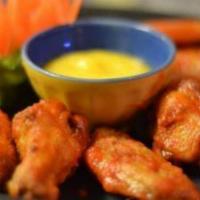 Sriracha Wings · Thai version of buffalo wings coated with spicy sriracha sauced, cooled off with mango dippi...